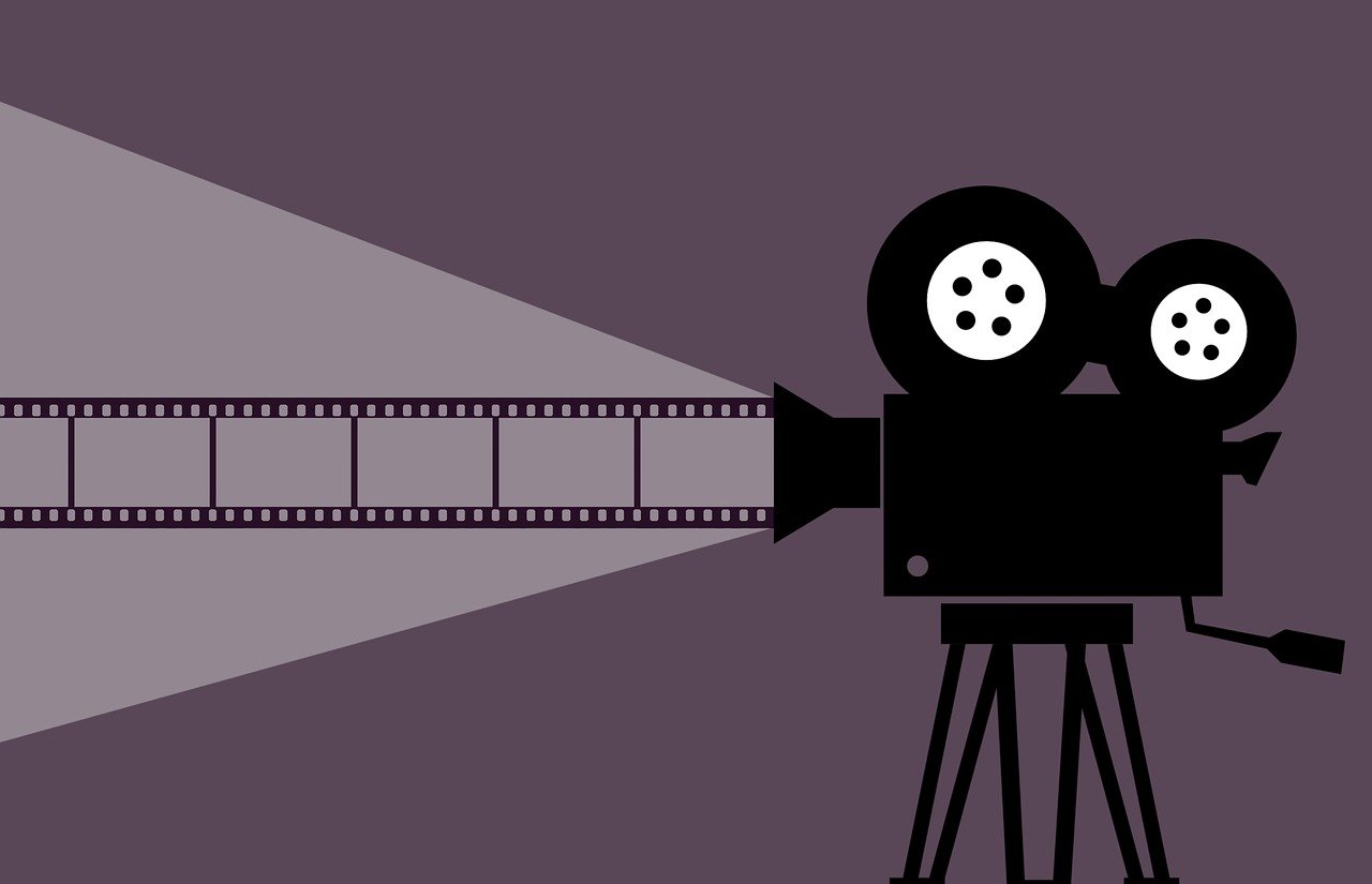 Kamera starego typu wyświetlajaca film. Kontury.
