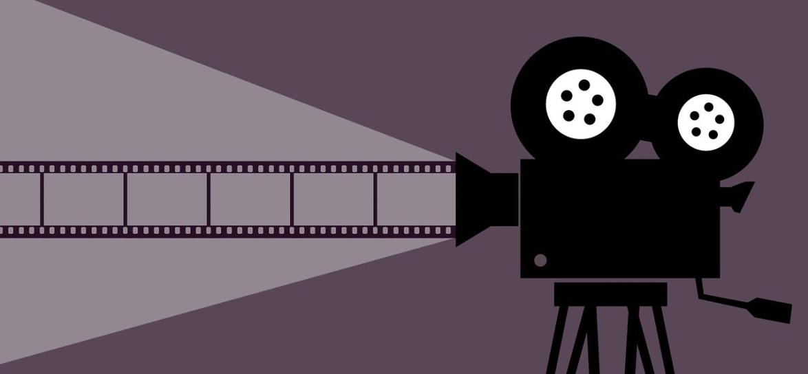 Kamera starego typu wyświetlajaca film. Kontury.