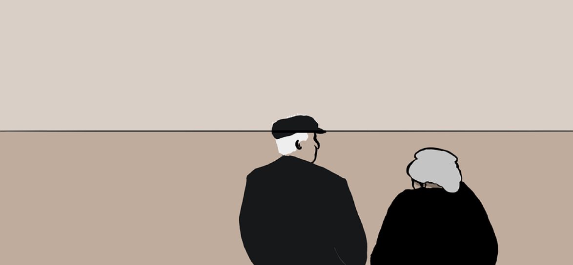 obrazek przedstawia dwie osoby, mężczyznę i kobietę, patrzących w kierunku odlatujących plaków